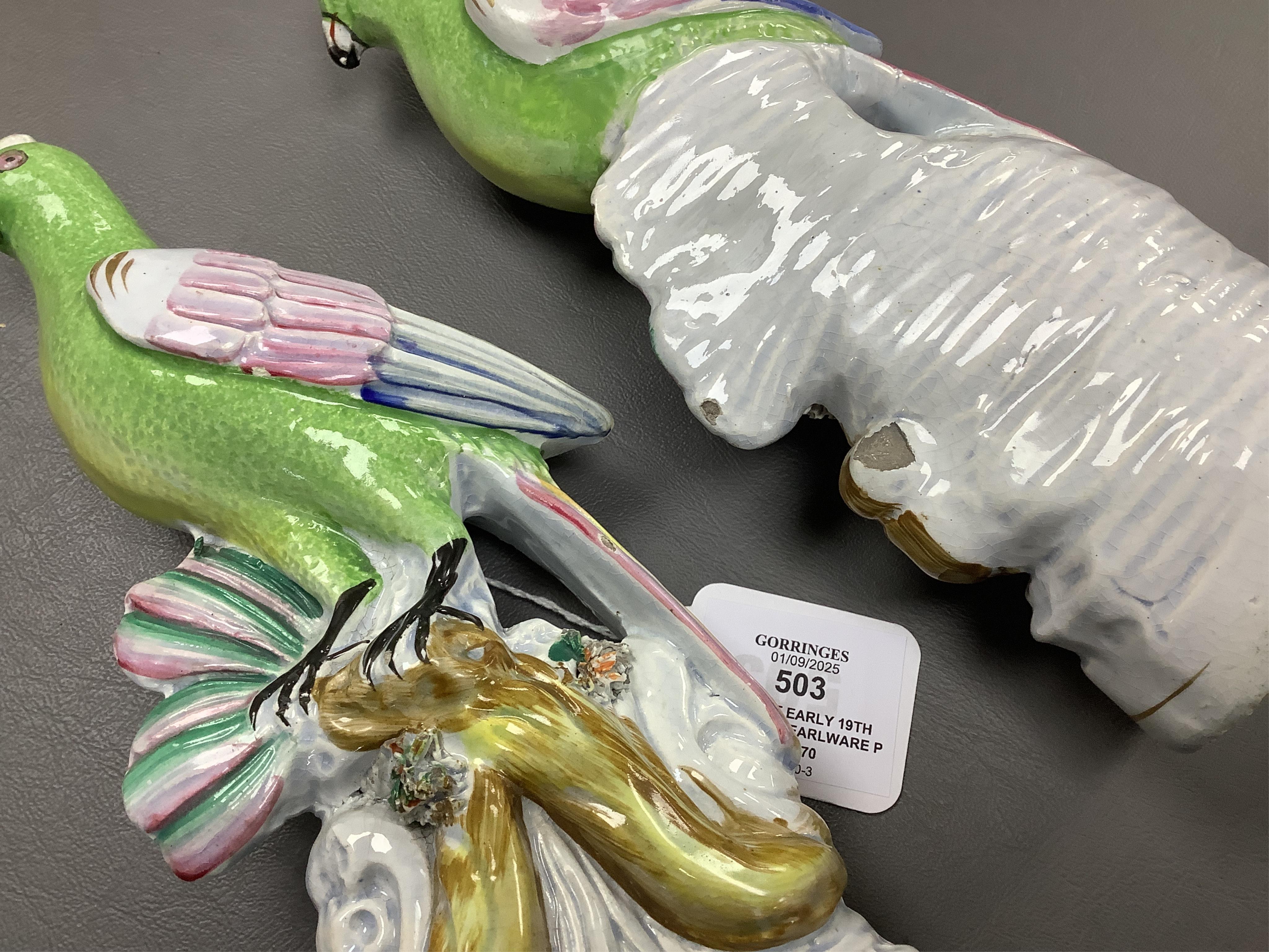 A pair of early 19th century pearlware parrots, ex John Howard, 24cm high